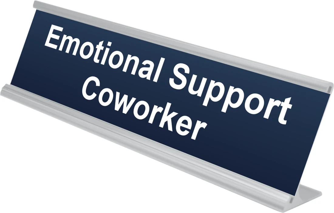 Emotional Support Coworker desk plate in navy, shown in an aluminum desk holder